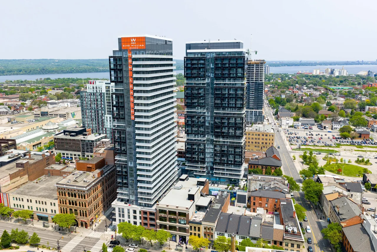 Aerial view of a cluster of high-rise condominiums near the water